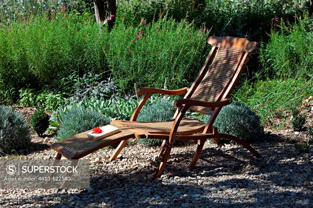 Caned chaise longue in the garden in Provence France