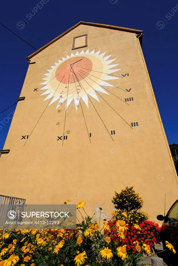 Sundial on the pinion of a house Alsace France