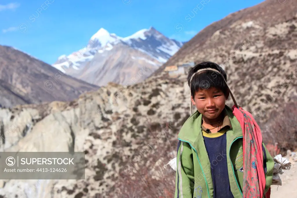 Portrait of a young boy carrying Gunsang Nepal Himalayas