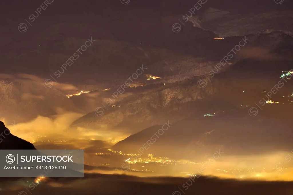 Fog over the valley of the Arve and light pollution France