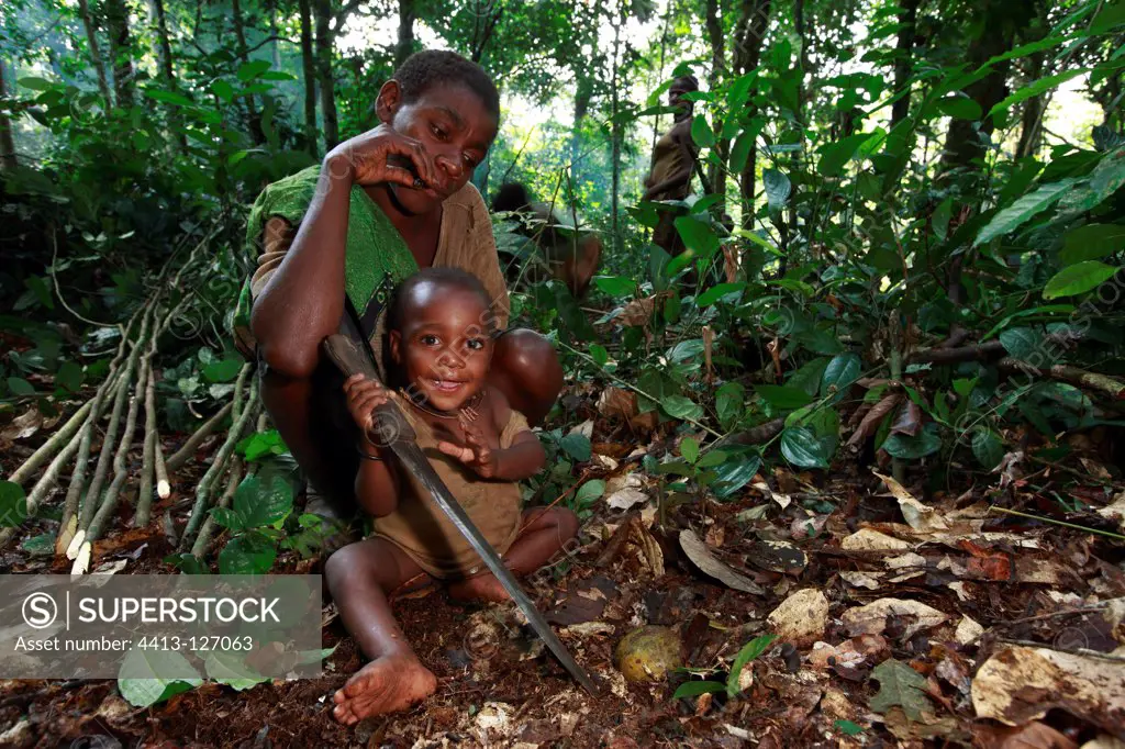 Pygmy Baaka child playing with a machete Cameroon