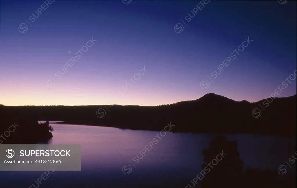 Moon rising on a lake La Toba Castilla Spain