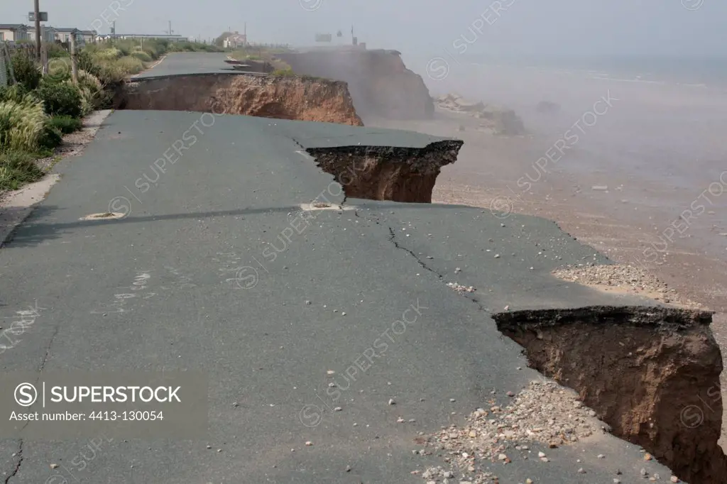 Collapsed tarmac road following cliff erosion on coast Yorks