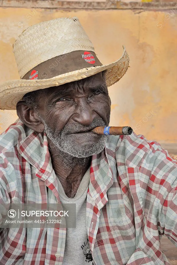 Portraits of Cuban man smoking a cigar in Trinidad Cuba