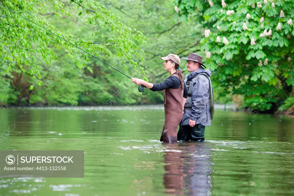 Professional guide fly fishing and his student Alsace France