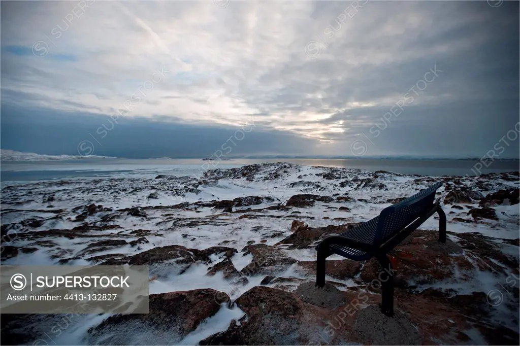 Bench on the shore of Frobisher Bay on Baffin Island Canada