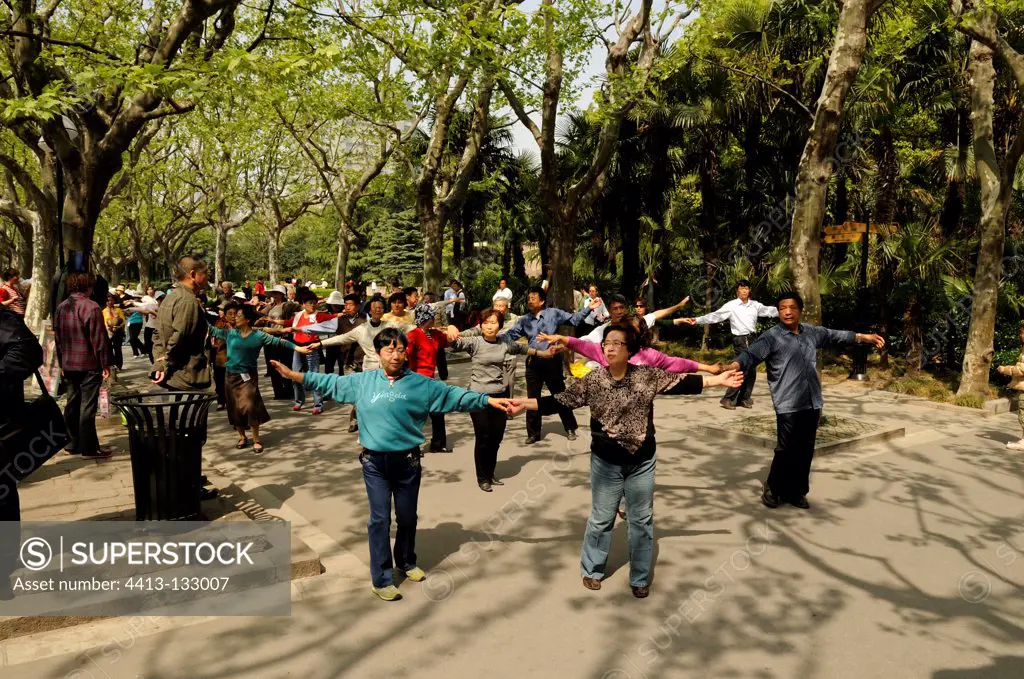 Dances in a public park in Shanghai China
