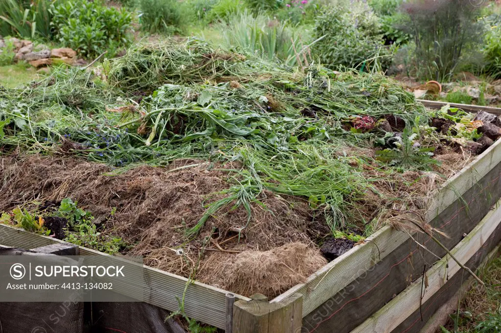 Compost stack with weed mowing