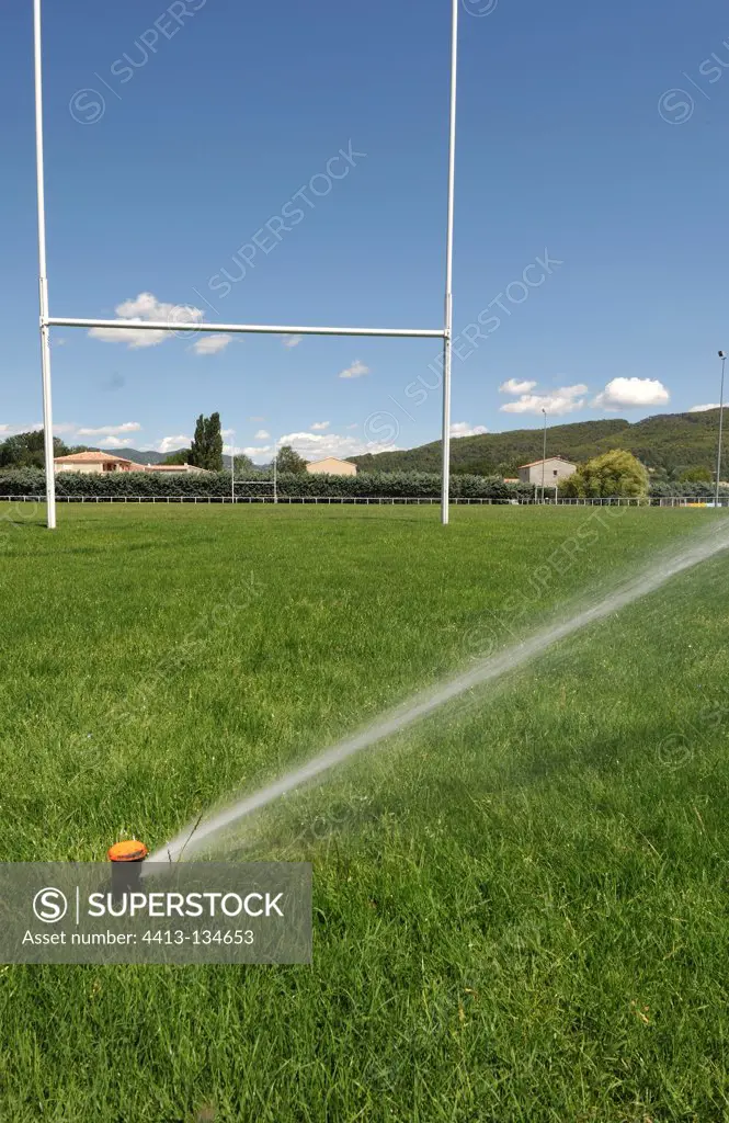 Automatic watering of a rugby field in summer France