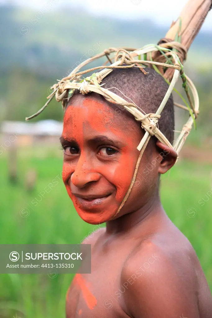 Boy with helmet and paint Papua New-Guinea
