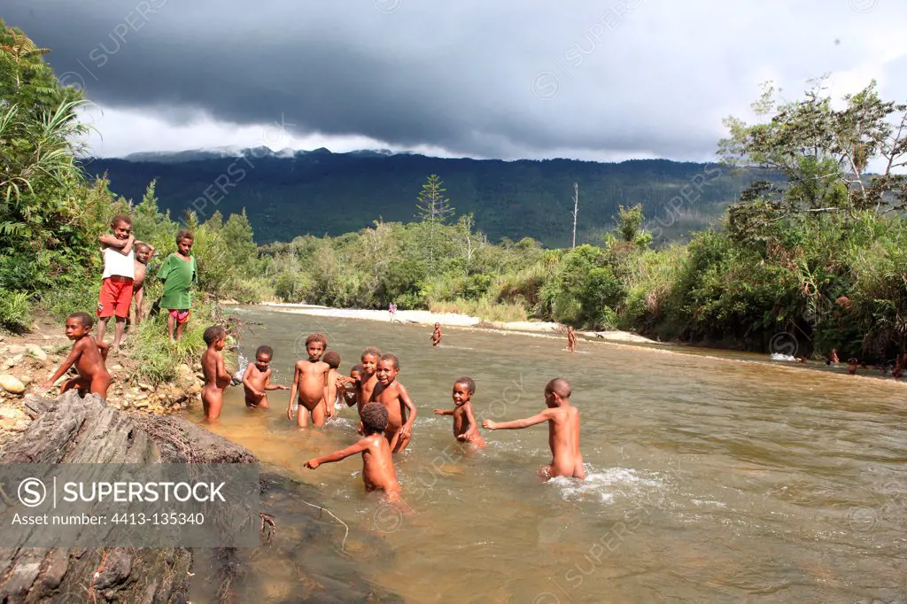 Children playing in the Sepik River Papua New-Guinea