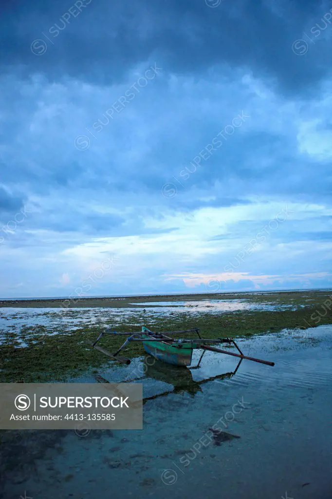 Outrigger boat at low tide Gili Air Indonesia