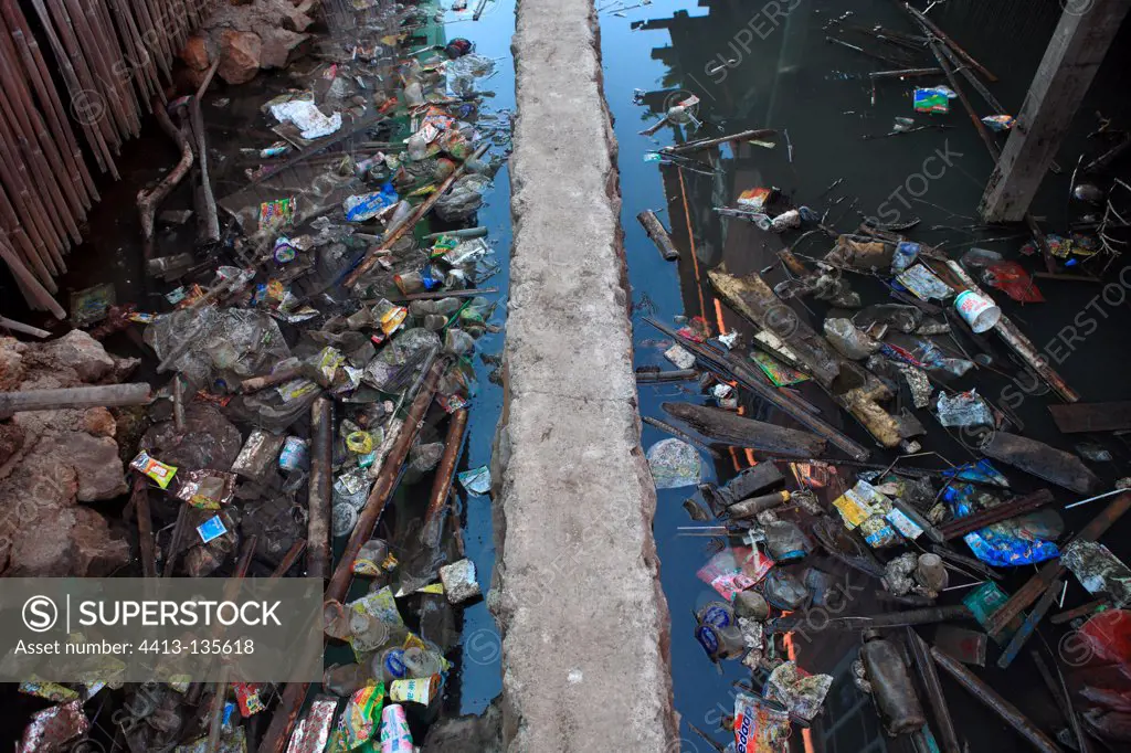 Waste between houses on stilts Sape Sumbawa Indonesia