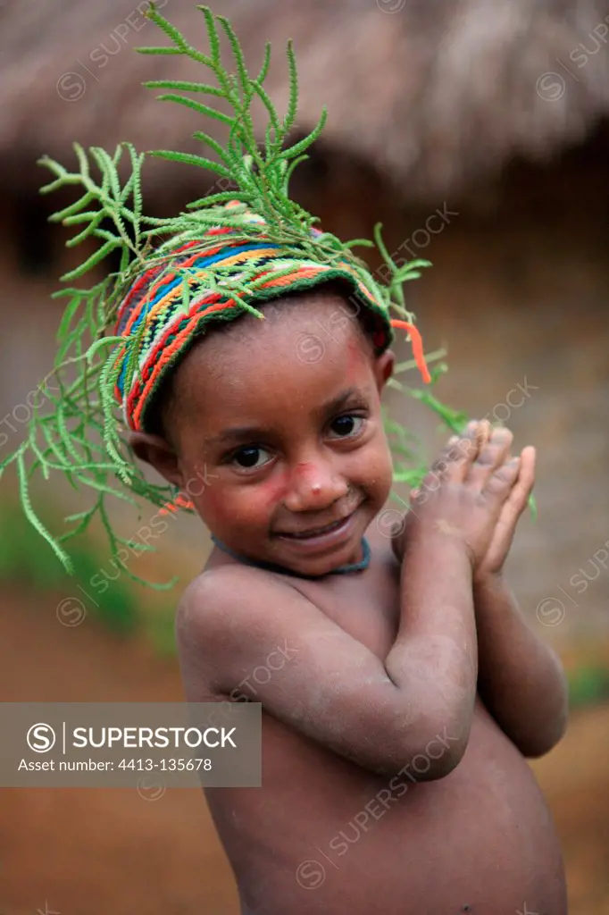 Boy with cap foliage Papua New-Guinea
