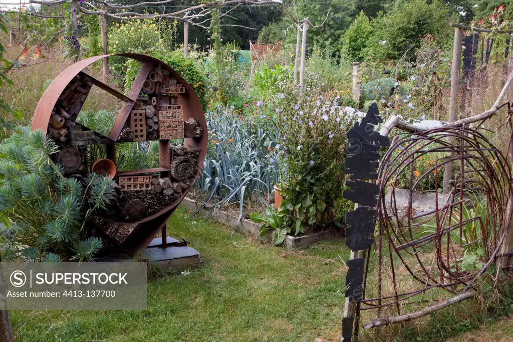 ""Insect hotel"" in an organic kitchen garden