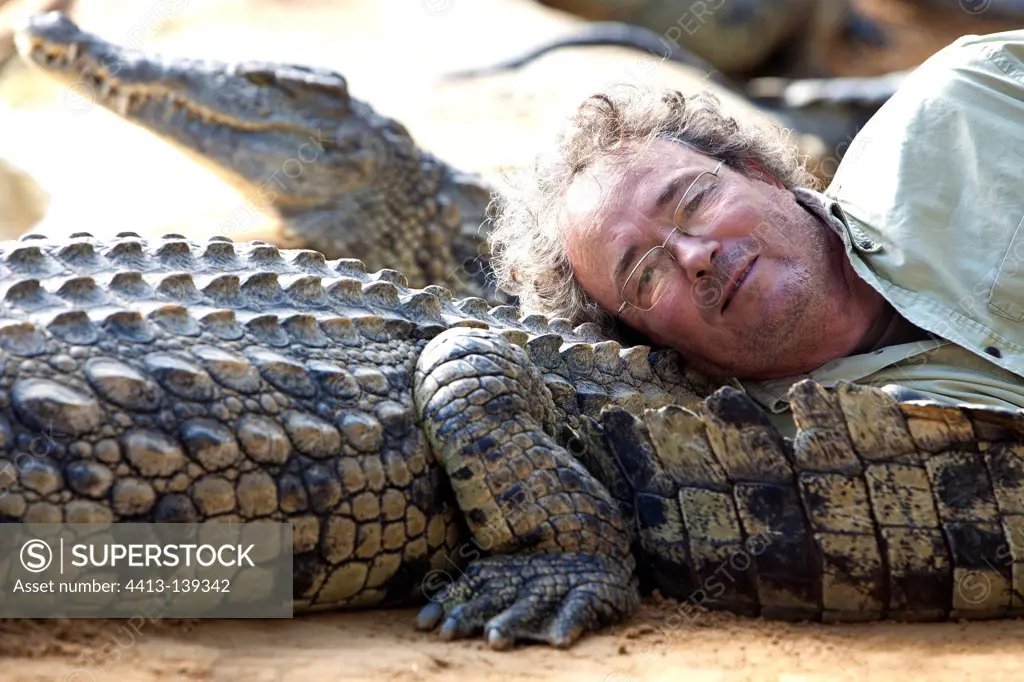 Luc Fougerolle resting on one of its Nile Crocodiles France