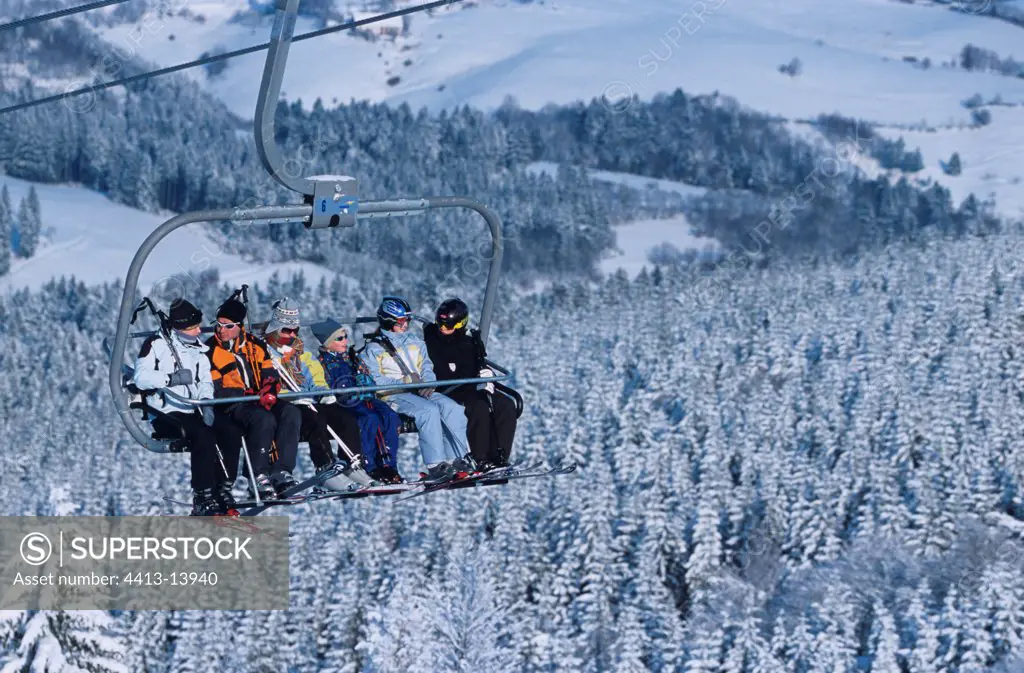 Skiers in a montaigne lift Vosges