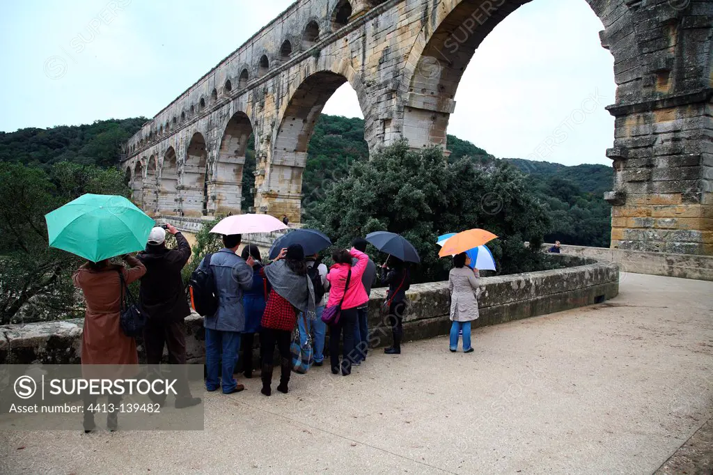 Japanese tourists photographing the Pont du Gard France