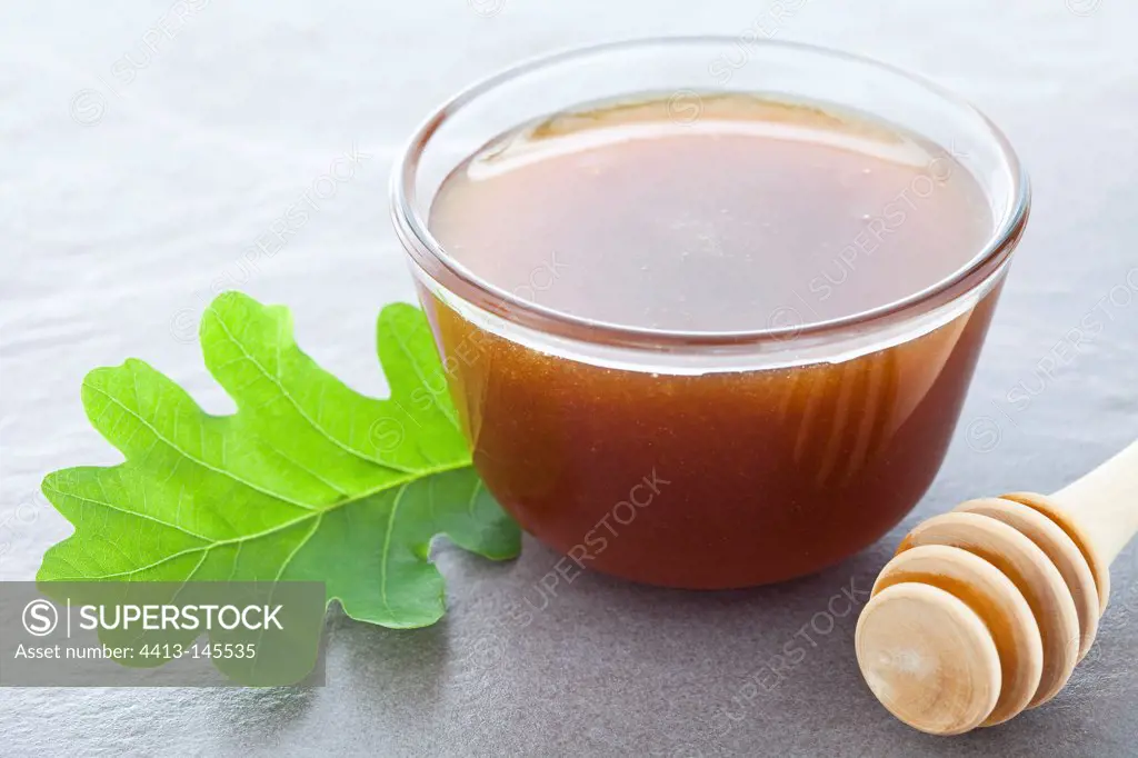 Ramekin of oak honey and oak leaf