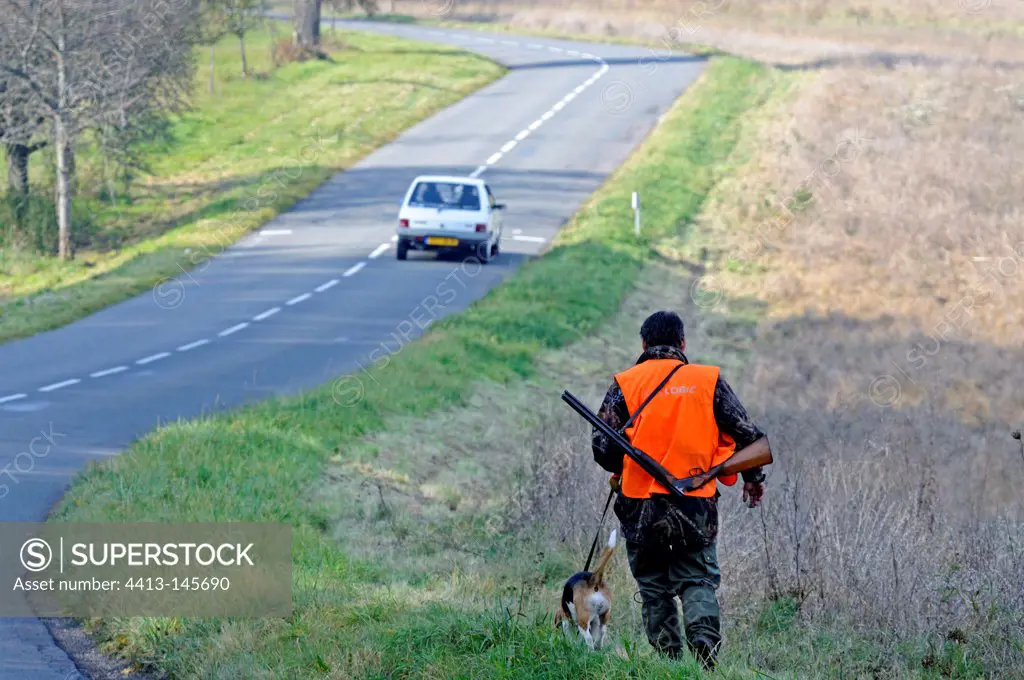 Hunter and his dog at the roadside to Vandoncourt France