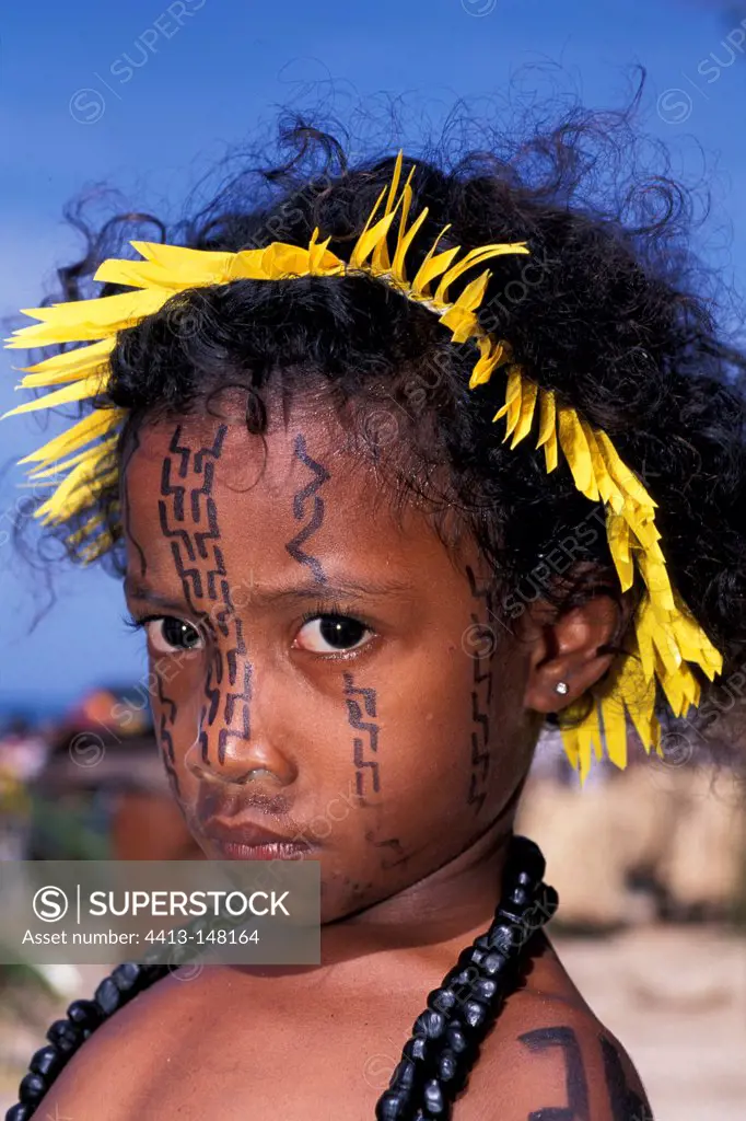 Girl with headdress and paint Papua New Guinea