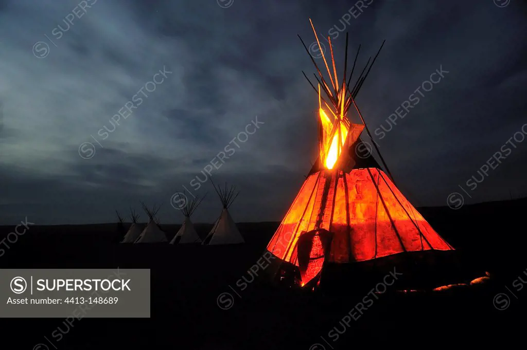 Campfire in a tepee in the moonlight in MontanaUSA