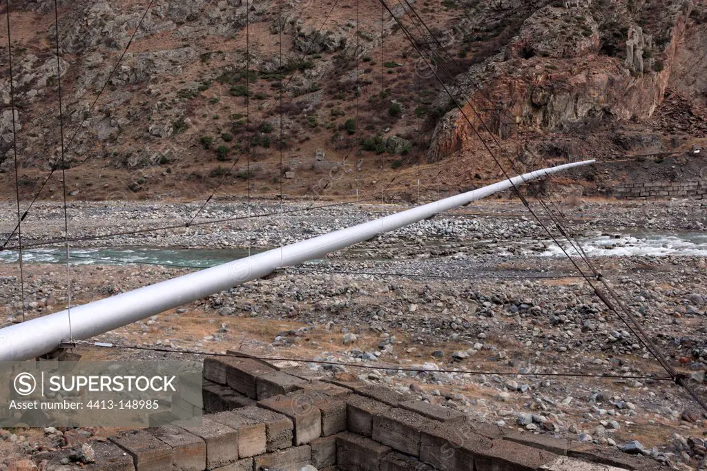 Pipeline on a bridge suspended above the Terek River