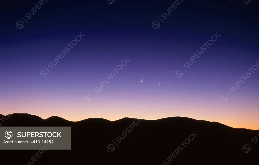 Conjunction Moon and Venus seen from Pyrenees France