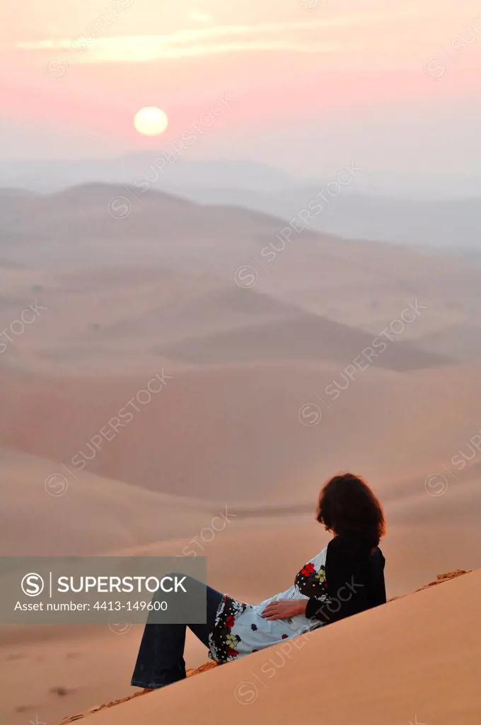 Woman resting in the desert of Rub al-Khali Abu Dhabi