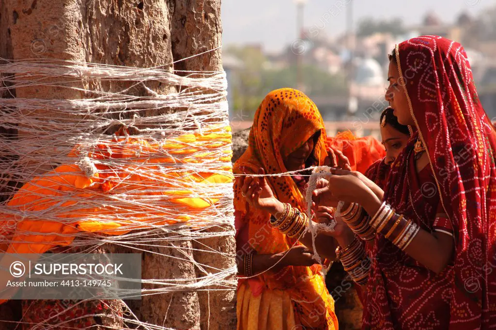 Women practicing a ritual to promote birth India