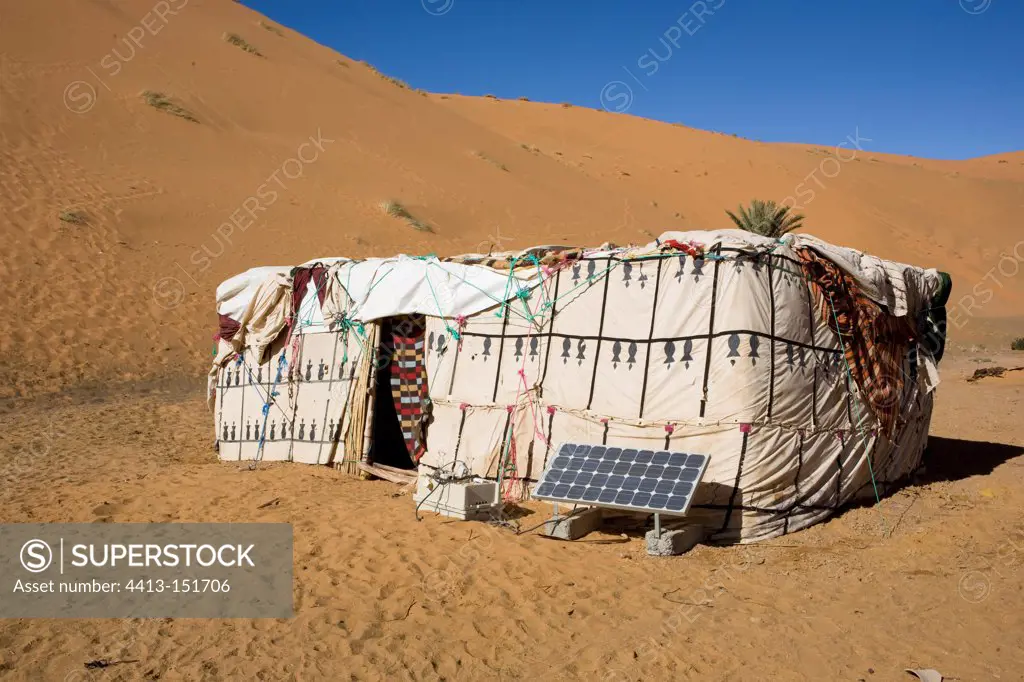 Berber tent and solar panel in the dunes of Merzouga