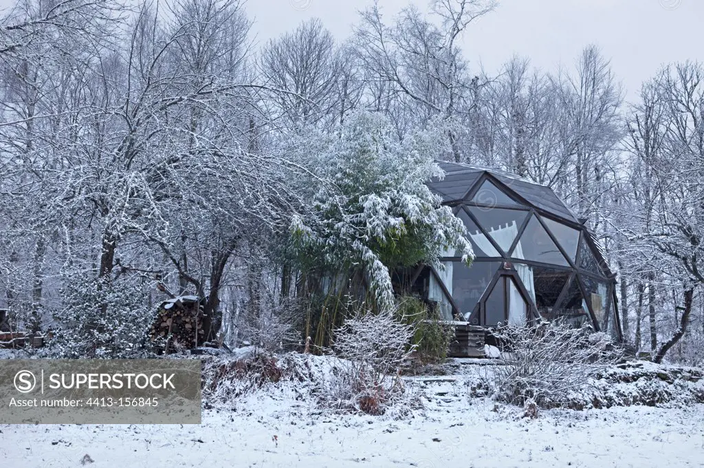 Garden and geodesic dome in winter France