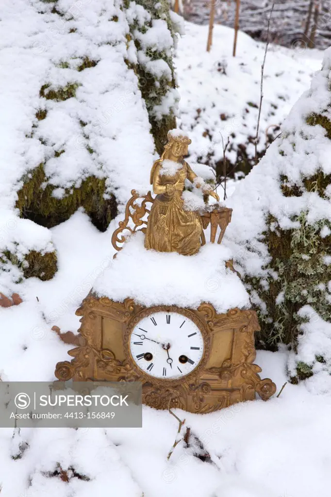 Clock in the snow in winter Ariege France