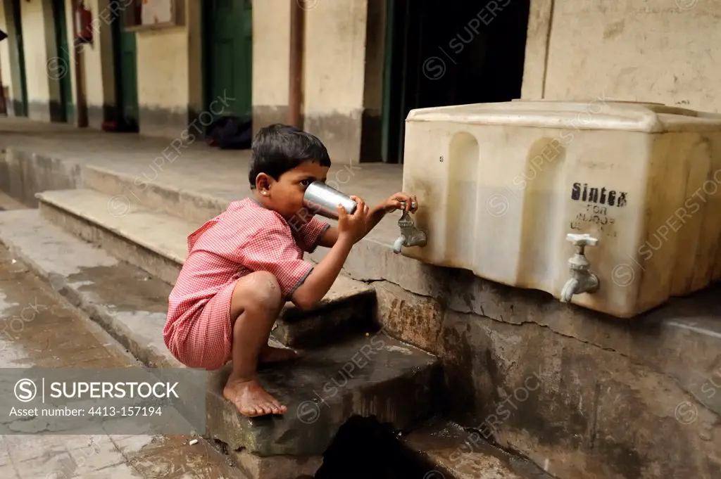 Schoolboy of the Tomorrow Foundation drinking Calcutta India
