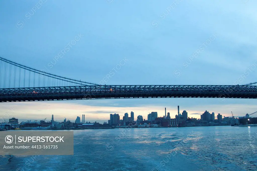 Brooklyn Bridge and buildings at sunset New York