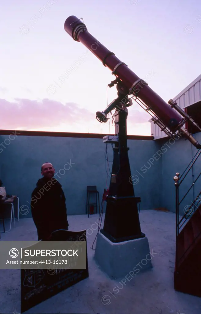 Father Josset's telescope with his restorer in observatory