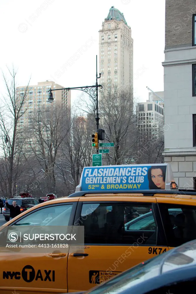 Advertising on a taxi and buildings in New York