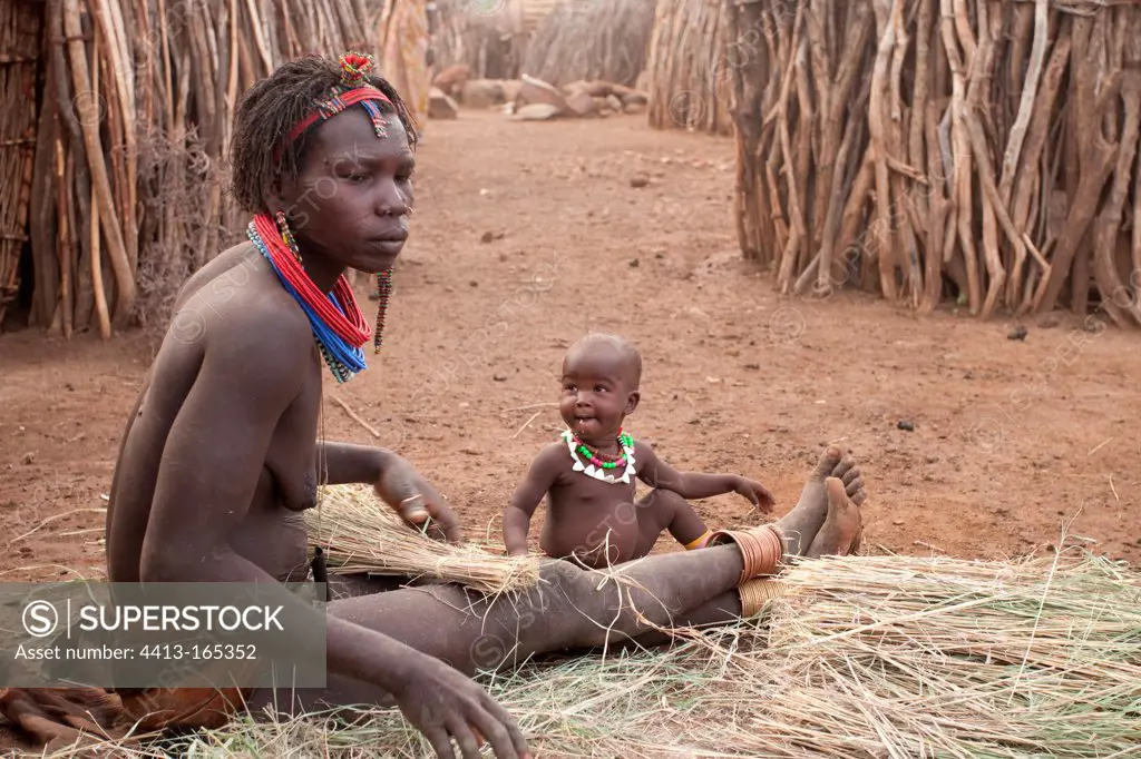 Woman and child in a Toposa village in southern Sudan