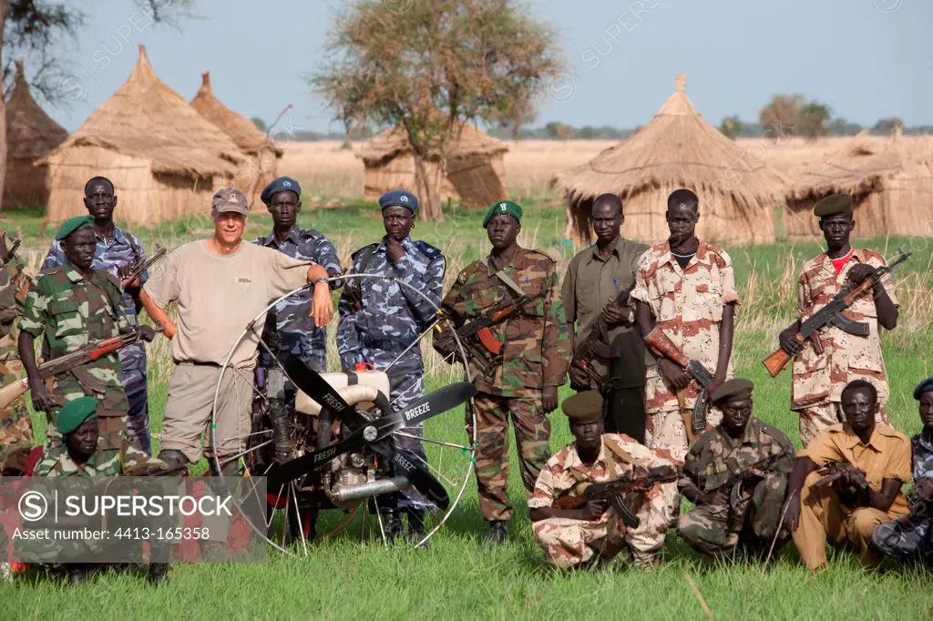 George Steinmetz photographed with a military escort