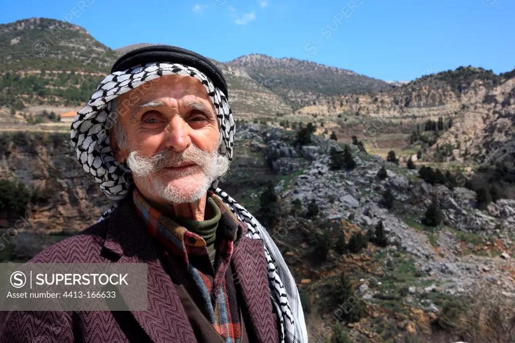 Elderly man smiling at Valley AfqaLebanon