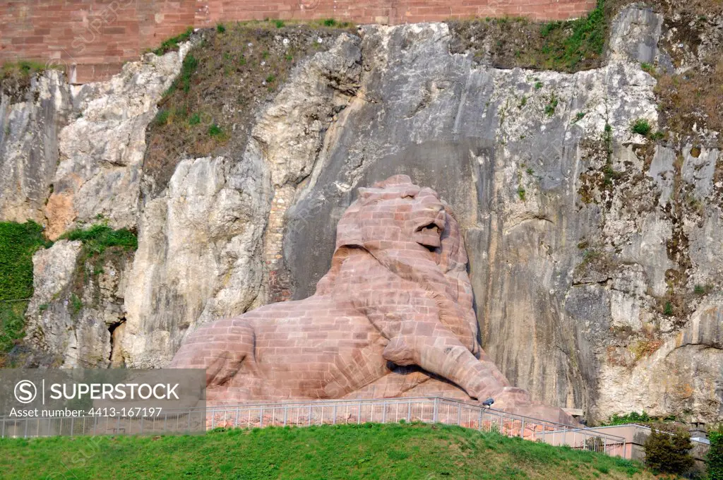 Sculpture The Lion de Belfort at the foot of a cliff France