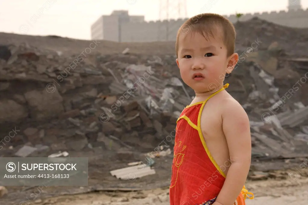 Child to a landfill on the outskirts of Beijing China