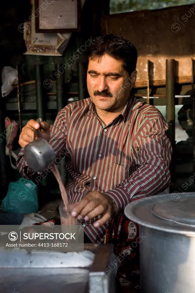 Men serve tea to the bus station in Srinagar India