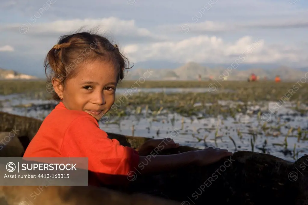 Portrait of girl in a canoe Messah Pulau Flores Indonesia