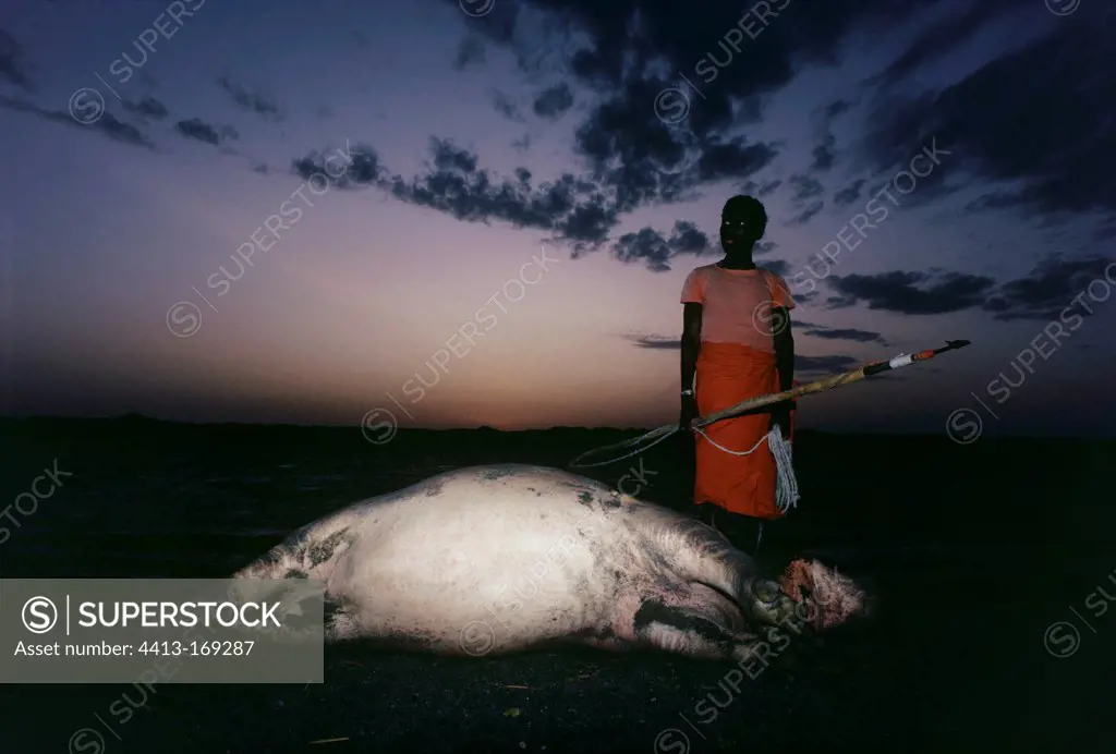 El Molo Warrior with dead hippopotamus Lake Turkana Kenya