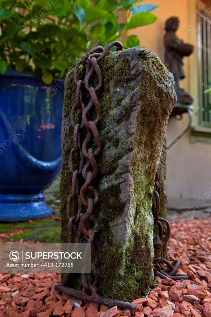 Chain on a stone in a garden