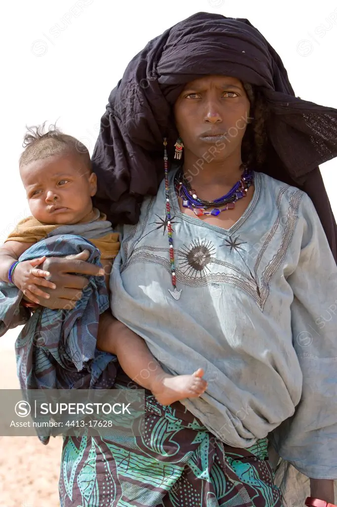 Tuareg woman carrying her baby Desert of Tenere Niger