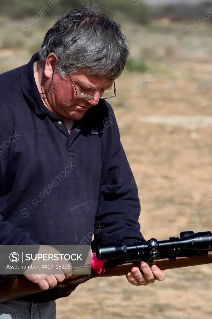 Man preparing his hypodermic rifle Tunisia