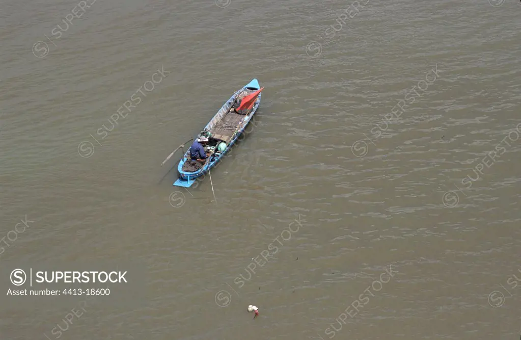 Fisherman on the Mekong seen from the bridge of Long Vinh