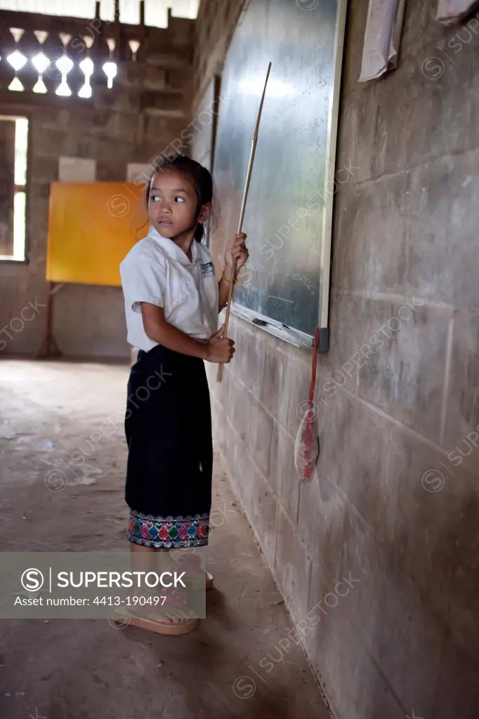 Girl playing the mistress of a school in Laos